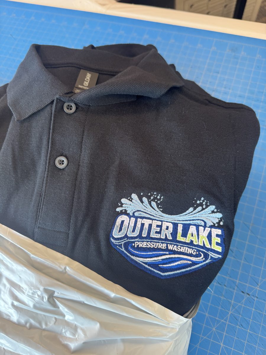 Embroidered Gildan polo with Outer Lake Pressure Washing logo on the left chest