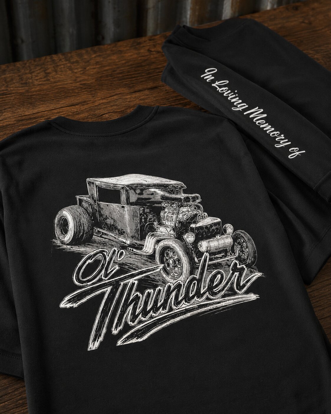 Ol' Thunder hot-rod memorial tee — detailed 1932-style coupe illustration with 'Ol' Thunder' script on the back, 'In Loving Memory Of' sleeve print, on a black long-sleeve tee